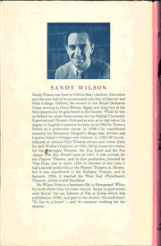 Book cover of 'The Boy Friend' by Sandy Wilson, with a black and white photograph and biography of the author.